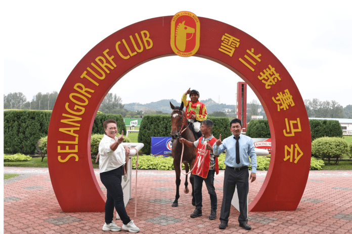 William Looi (right) kicked off his career as a trainer in his own right in the best way possible at Selangor.