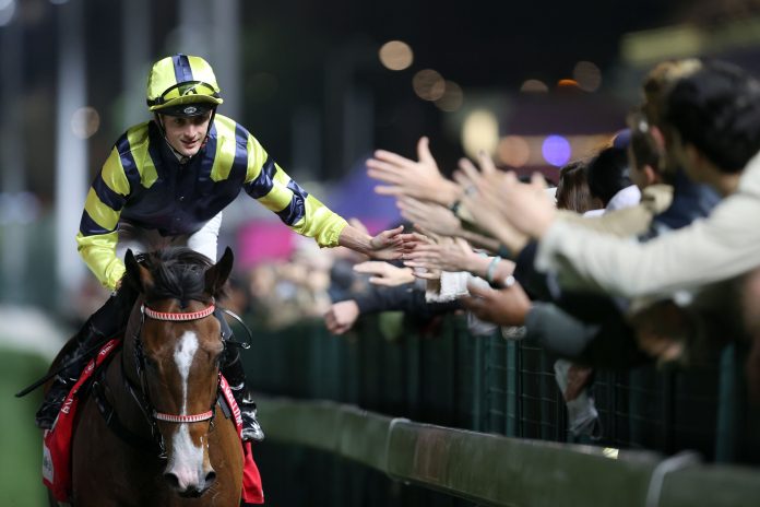 The man on the hour. Harry Bentley rings up a double at Happy Valley on Wednesday night.
