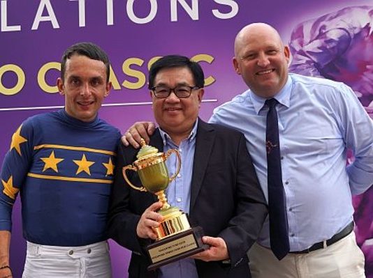 The same winning trio hogs the limelight again after Lim's Bighorn's victory: (from left) jockey Marc Lerner, owner Mr Lim Siah Mong and trainer Daniel Meagher.