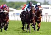 Asfoora powers to victory for Australia in King Charles III The King and Oisin Murphy during the trophy presentation (David Davies/PA)